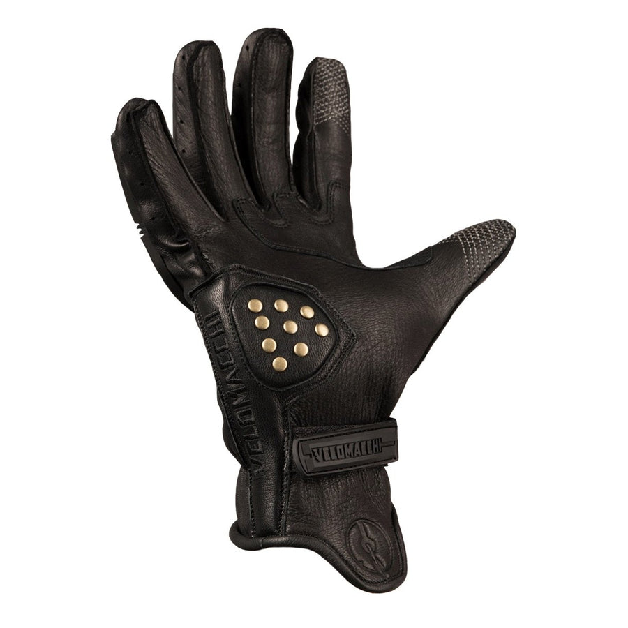 These motorcycle gloves have patterned fourchettes, reinforced brass rivets, Velcro wrist closure.