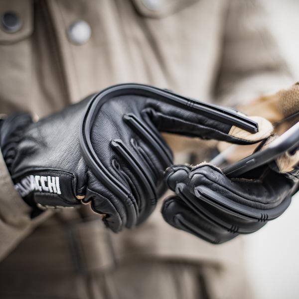 These motorcycle gloves feature conductive finger and thumb tips for touch screen a smartphone.